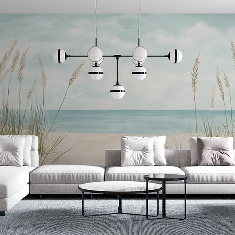 Beach scene wallpaper creating a peaceful coastal atmosphere in a bright modern living room with natural light
