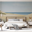 Beach wallpaper mural shown in modern living room, highlighting the minimalist coastal dunes design against white furniture