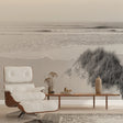 Black and white beach wallpaper creating a serene focal point in a modern living room with minimal furniture