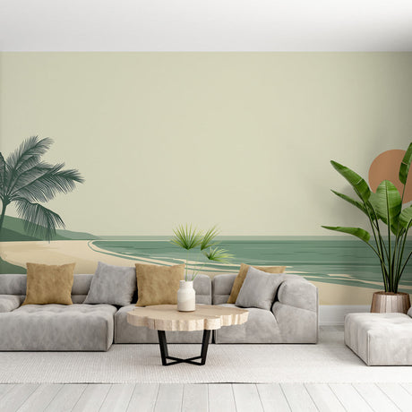 Beach mural wallpaper styled in modern living room showing minimalist coastal scene with gentle palm trees and sage tones