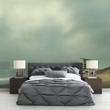 Beach scene wallpaper with lifeguard tower shown in a bright living room with coastal decor and natural light