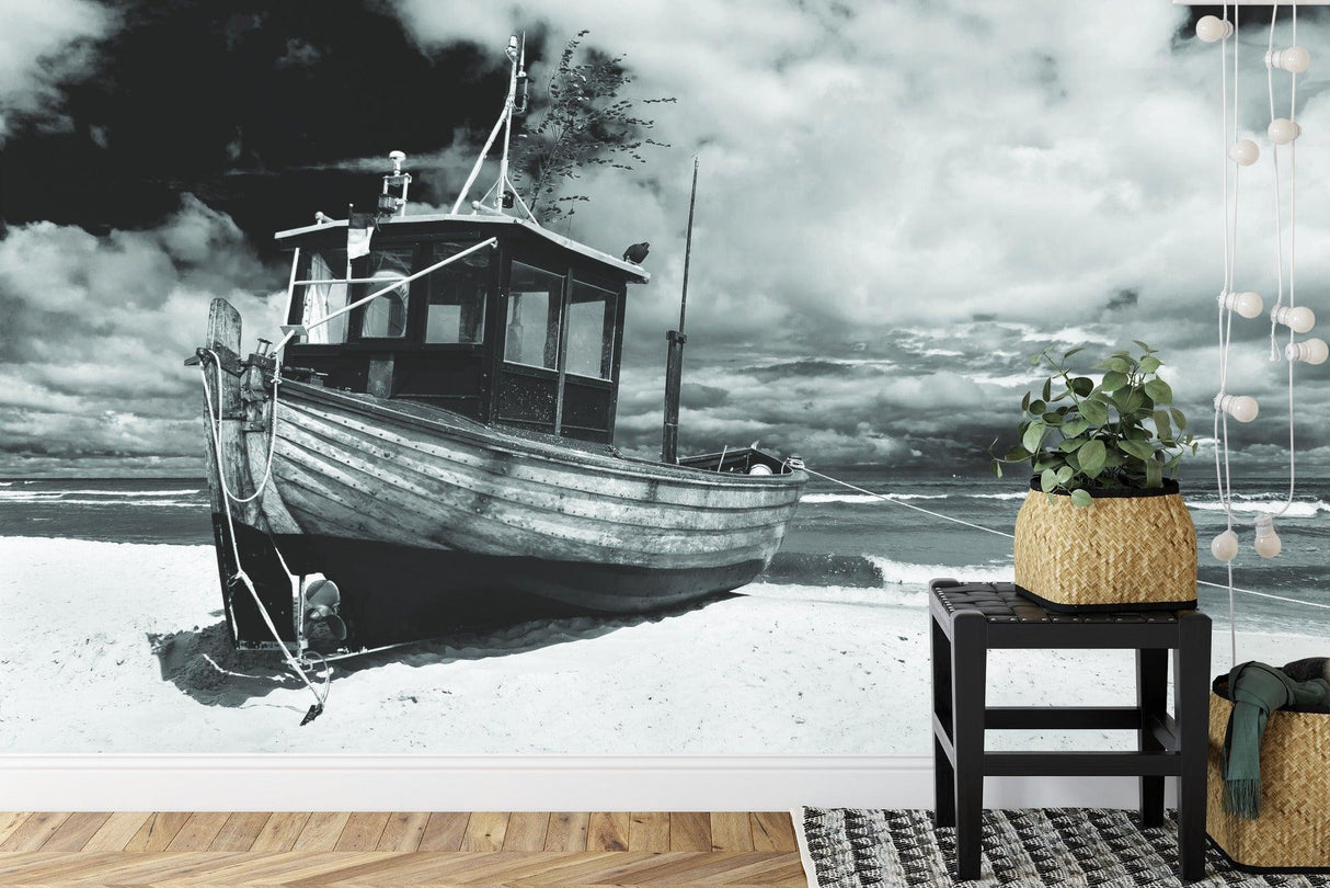 Beach wall mural creating peaceful atmosphere in modern living room with monochrome fishing boat design