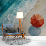 Beach scene wallpaper with red parasol transforms this bright living room into a coastal retreat