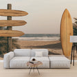 Beach scene wallpaper with surfboard creates a relaxing coastal atmosphere in a modern living room setting