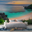 Tropical beach paradise wallpaper creating a stunning focal point in a modern living room with clean white furniture