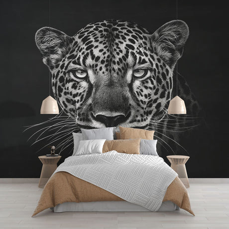 Black and white leopard wallpaper mural creating dramatic impact in a modern living room with minimalist furniture