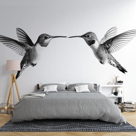 Black and white hummingbird wallpaper mural showcased in a modern living room with minimal furniture