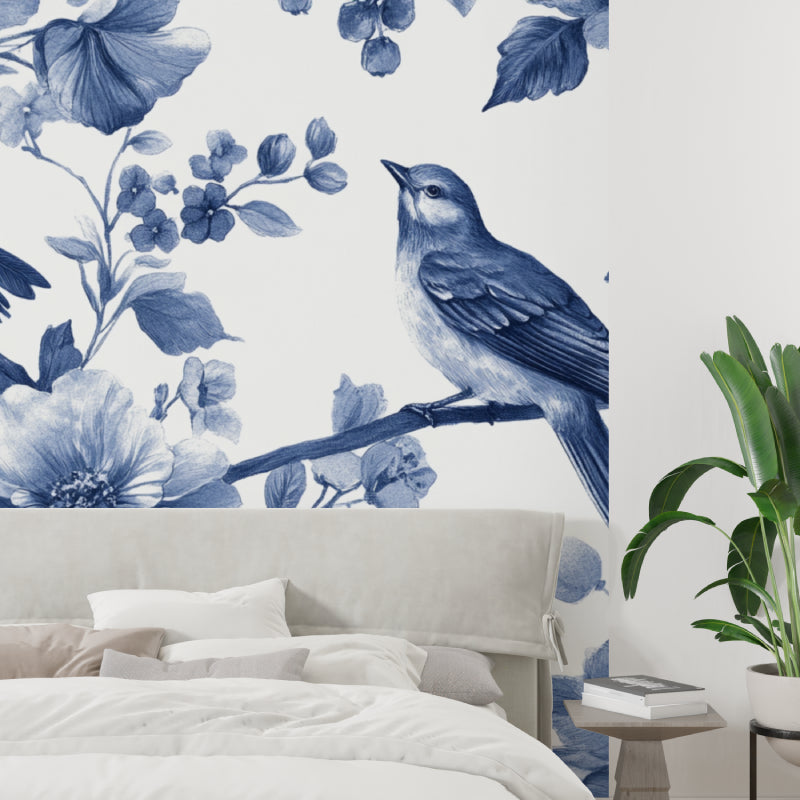 Blue bird wallpaper mural in bright modern living room showing watercolor floral design