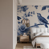 Elegant dining room featuring blue floral bird wallpaper with soft lighting
