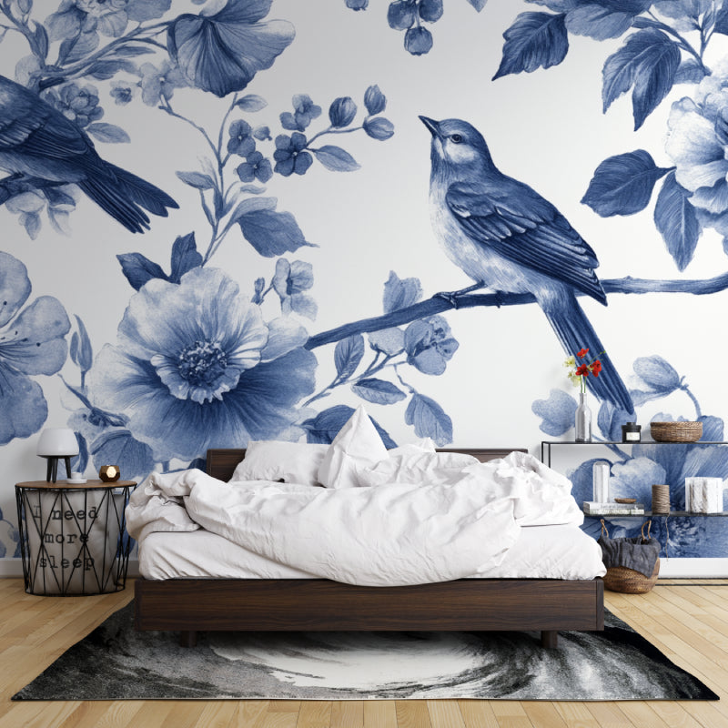 Reading nook decorated with serene blue floral bird mural wallpaper