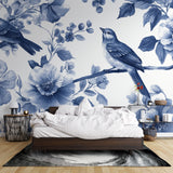 Reading nook decorated with serene blue floral bird mural wallpaper