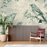 Botanical bird wallpaper transforming a home office with calm green tones