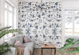 Blue and white bird wallpaper in a cozy reading nook with window seat
