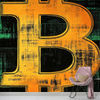 Bitcoin wall mural displayed in a modern office space, orange typography design creating a bold focal point against dark walls