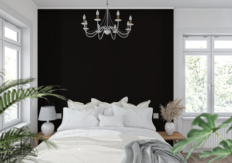 Black geometric wallpaper in modern living room creating dramatic accent wall