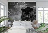 Black panther wall art displayed in hallway with modern lighting fixtures