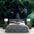 Black panther jungle wallpaper creating dramatic atmosphere in modern living room with green accents
