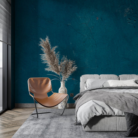 Teal textured wallpaper in modern living room with natural light highlighting surface details
