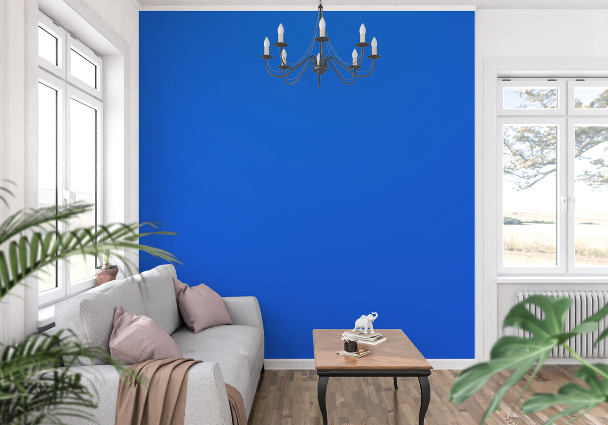 Modern blue wallpaper installation in a sleek bedroom with natural lighting
