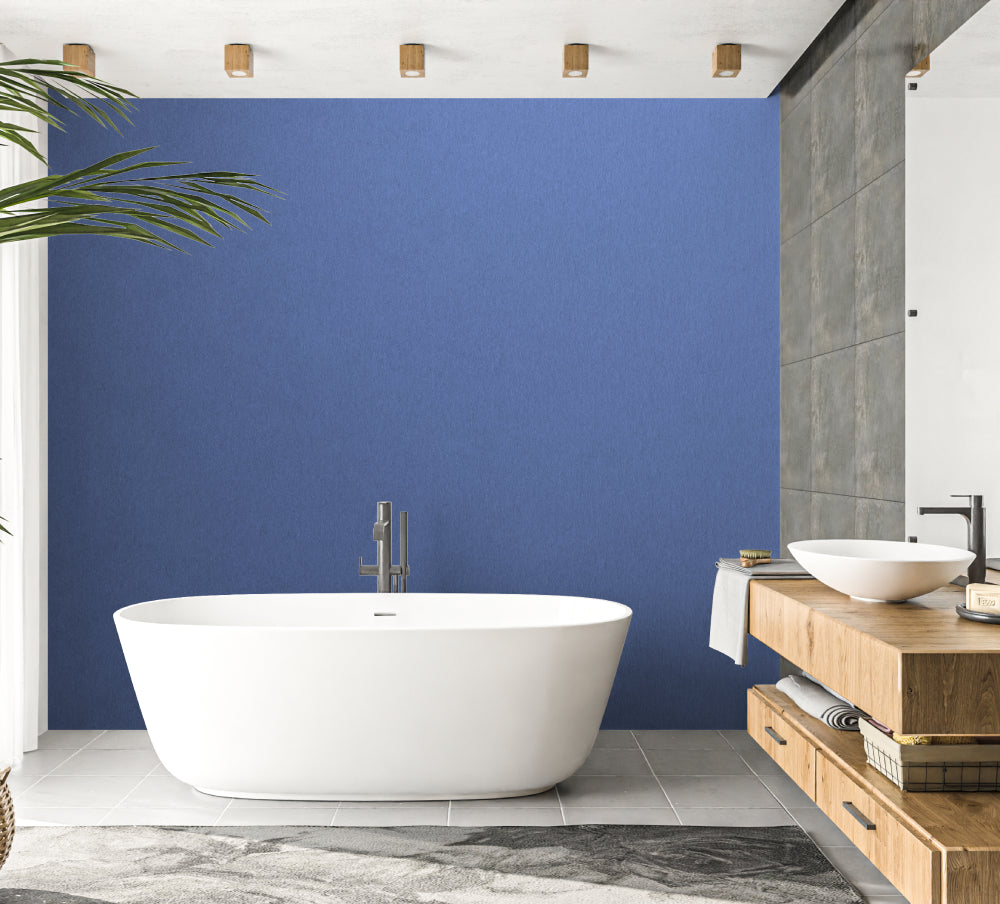 Modern blue wall mural in a minimalist living room with natural light streaming through large windows