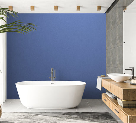 Modern blue wall mural in a minimalist living room with natural light streaming through large windows