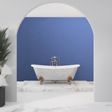 Solid blue wall mural in a modern dining room highlighting clean architectural lines