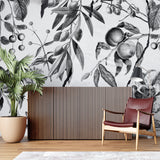 Botanical wall art installation in modern kitchen featuring fruit motifs