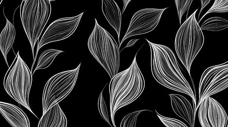 Black and white botanical leaf wallpaper creating a modern statement wall in a minimalist living room with white furniture