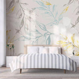 Elegant botanical wallpaper featuring blue-grey leaves in a bright home office setting