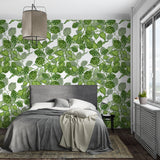 Fresh green botanical wallpaper making a bedroom feel like a garden retreat