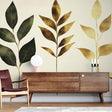 Botanical leaf wallpaper with gold accents creating an elegant atmosphere in a modern living room with natural light