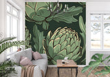 Green artichoke botanical wallpaper making a statement in a cozy living room setting