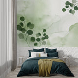 Botanical wall mural brightening up a cozy bedroom with soft morning light
