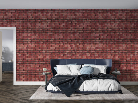 Red brick wallpaper creating industrial charm in modern living room with grey sofa and plants