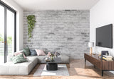 Stone brick wallpaper creating industrial atmosphere in kitchen