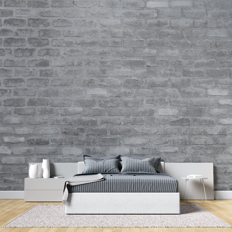 Grey brick wallpaper in modern minimalist living room with leather sofa and industrial lighting