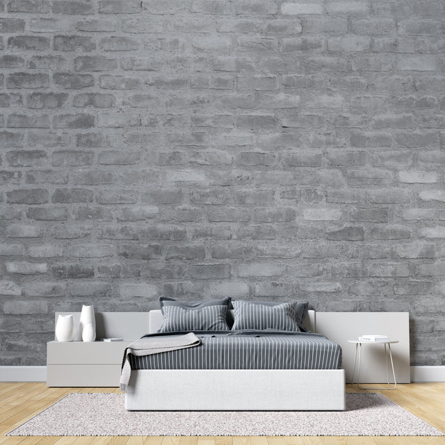 Grey brick wallpaper in modern minimalist living room with leather sofa and industrial lighting