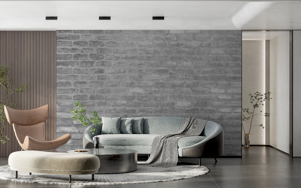 Grey brick mural wallpaper in home office with modern desk and black accents