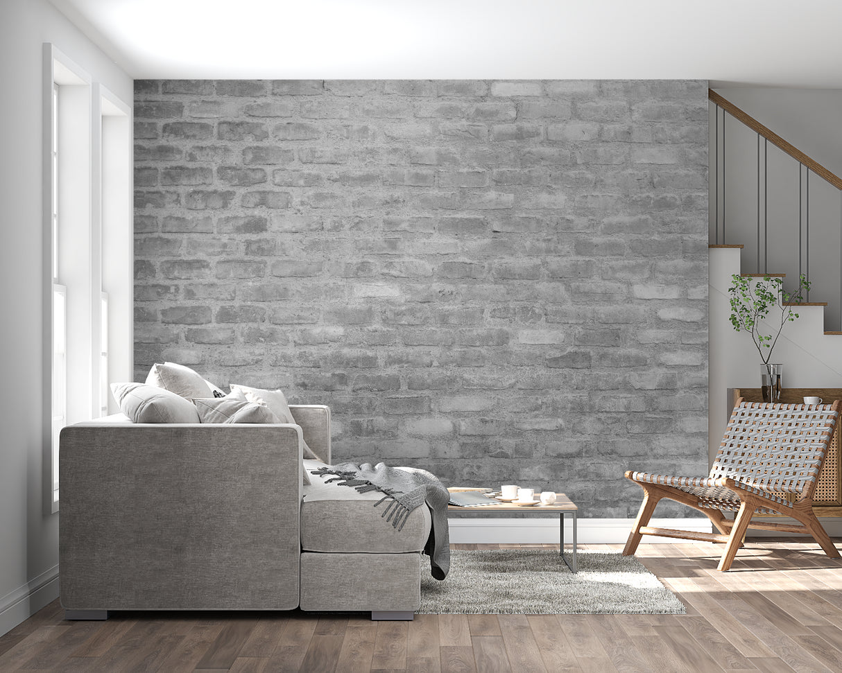 Industrial brick wallpaper creating accent wall in bedroom with metal bed frame