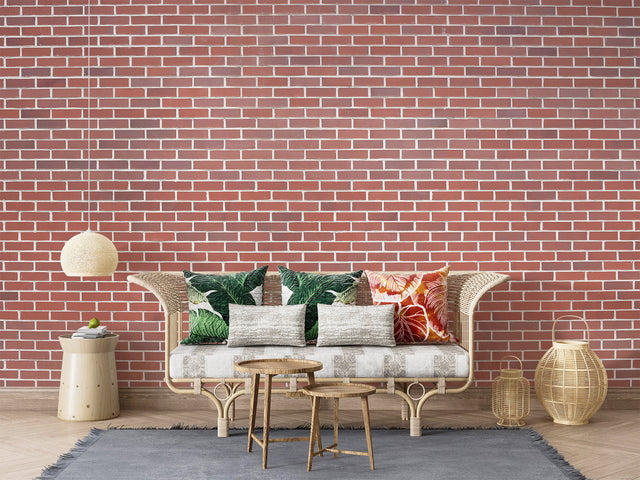 Red brick wallpaper bringing industrial charm to a modern living room with leather furniture