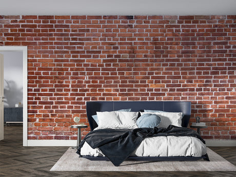 Red brick wallpaper creating an industrial atmosphere in a modern living room with high ceilings