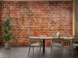 Brick wall mural in modern living room with leather sofa and industrial lighting