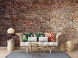 Red brick wallpaper mural in modern living room with grey sofa and industrial lighting