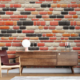 Brick mural wallpaper creating an industrial accent wall in a modern living room with minimal furniture
