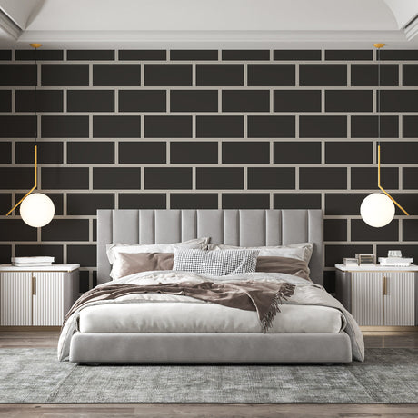 Modern black brick wallpaper creating a striking feature wall in a minimalist living room with grey sofa and metal accents