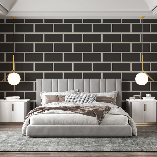 Modern black brick wallpaper creating a striking feature wall in a minimalist living room with grey sofa and metal accents