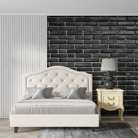 Black brick wallpaper in modern living room with grey sofa and industrial lighting