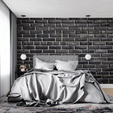 Black brick wall mural installation in modern home office showing depth and texture