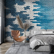 Modern blue brick wallpaper mural creating depth in a minimalist living room with white furniture and natural light