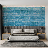Modern blue brick wallpaper in a minimalist living room creating an urban industrial atmosphere
